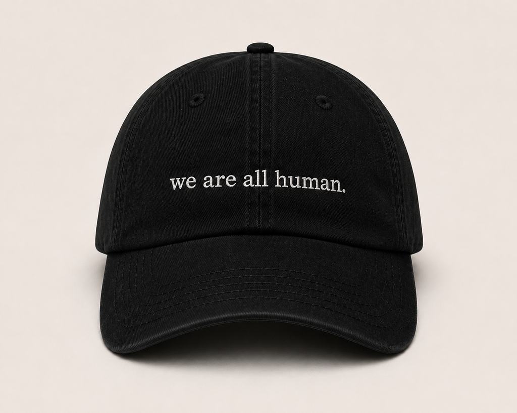 “we are all human.” Hat (Pre-Order)